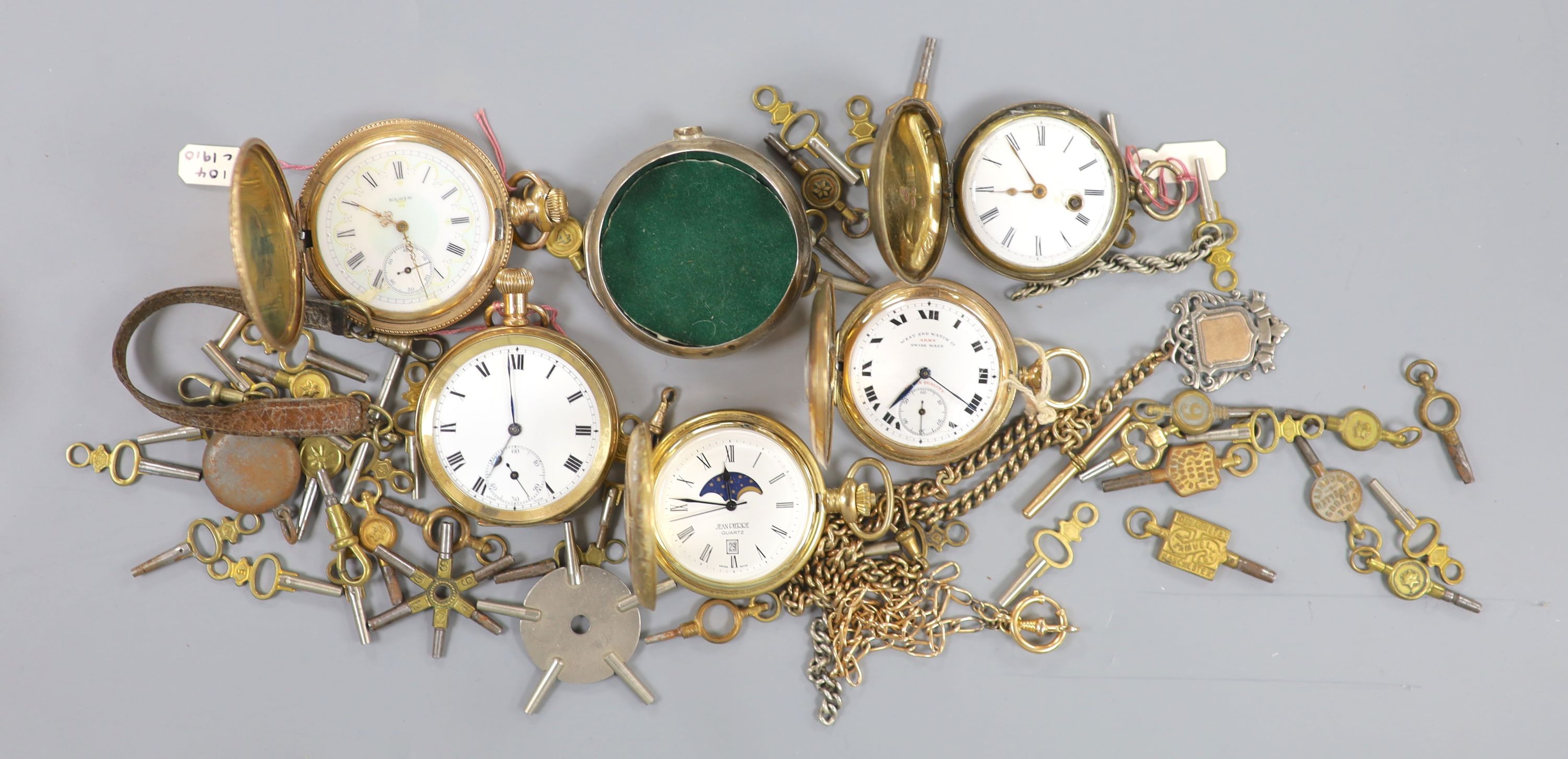 An early 20th century gold plated keyless pocket watch, a gold plated half hunter, three other pocket watches and watch accessories, including keys.